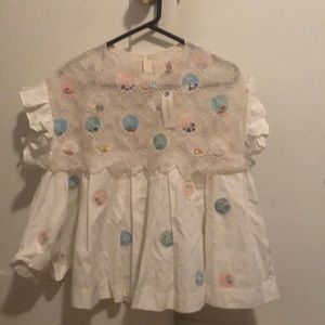 Anthropologie carousel pleated swing blouse